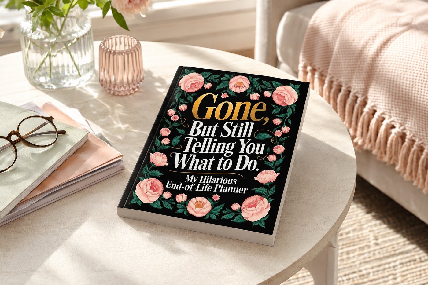 The End of Life Planner propped on a hall console beside keys, a notebook and a vase.